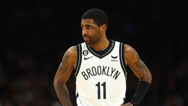 Kyrie Irving looks on during a game.